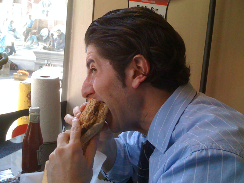 Lee eats a Charlie Brown (peanut butter & bacon) cheesesteak (Jake\'s, Philly)