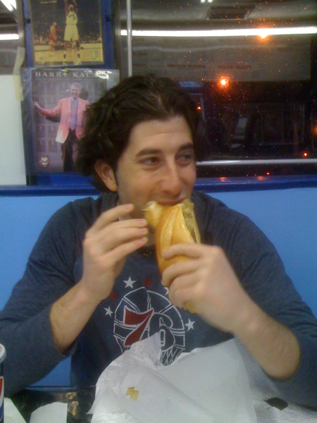 Lee eats a cheesesteak (post-Sixers game)