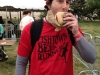 Lee eats a shad cake sandwich at Shad Fest (Philly)