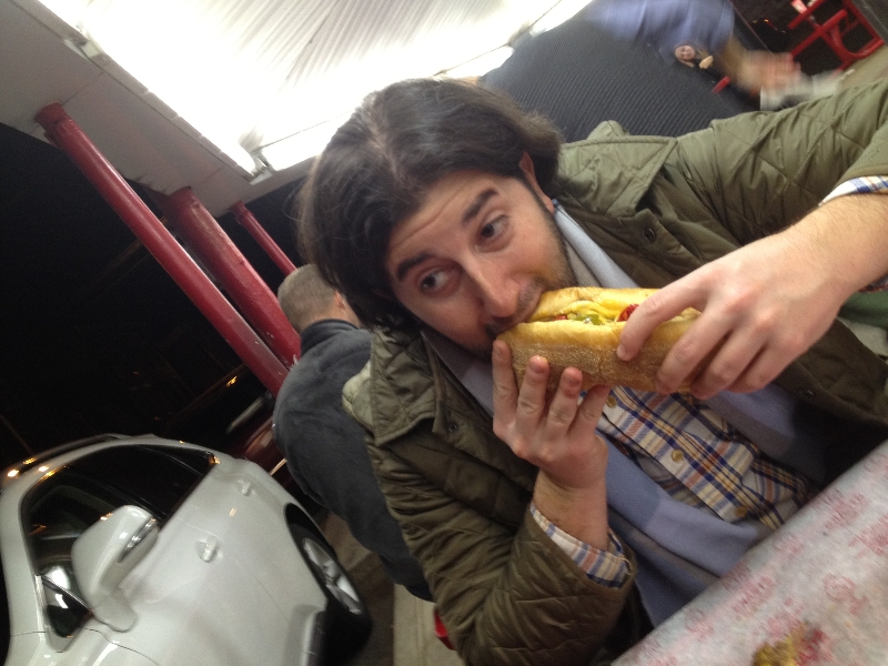 Lee eats a cheesesteak at Pat\'s (Philly)