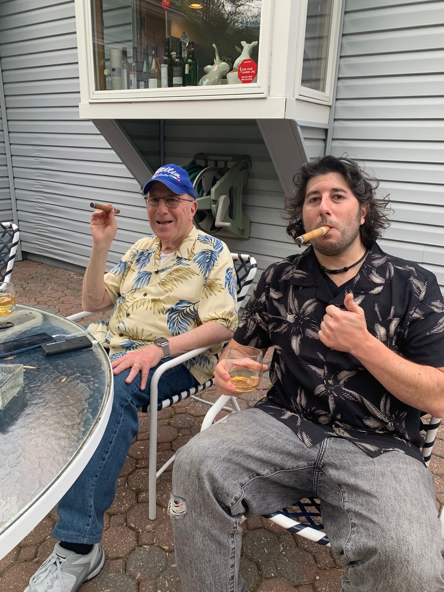 Lee eats (smokes) cigars with JP.