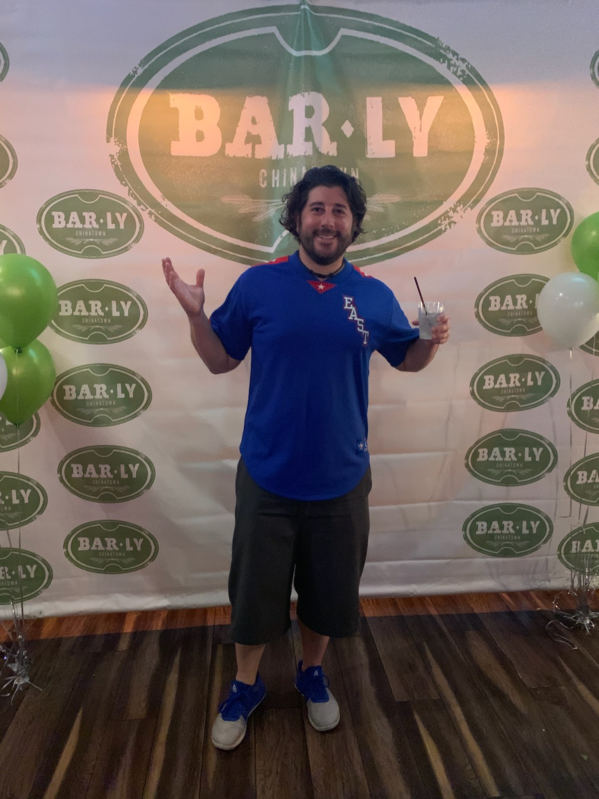 Lee shrugs at BarLy's anniversary party.